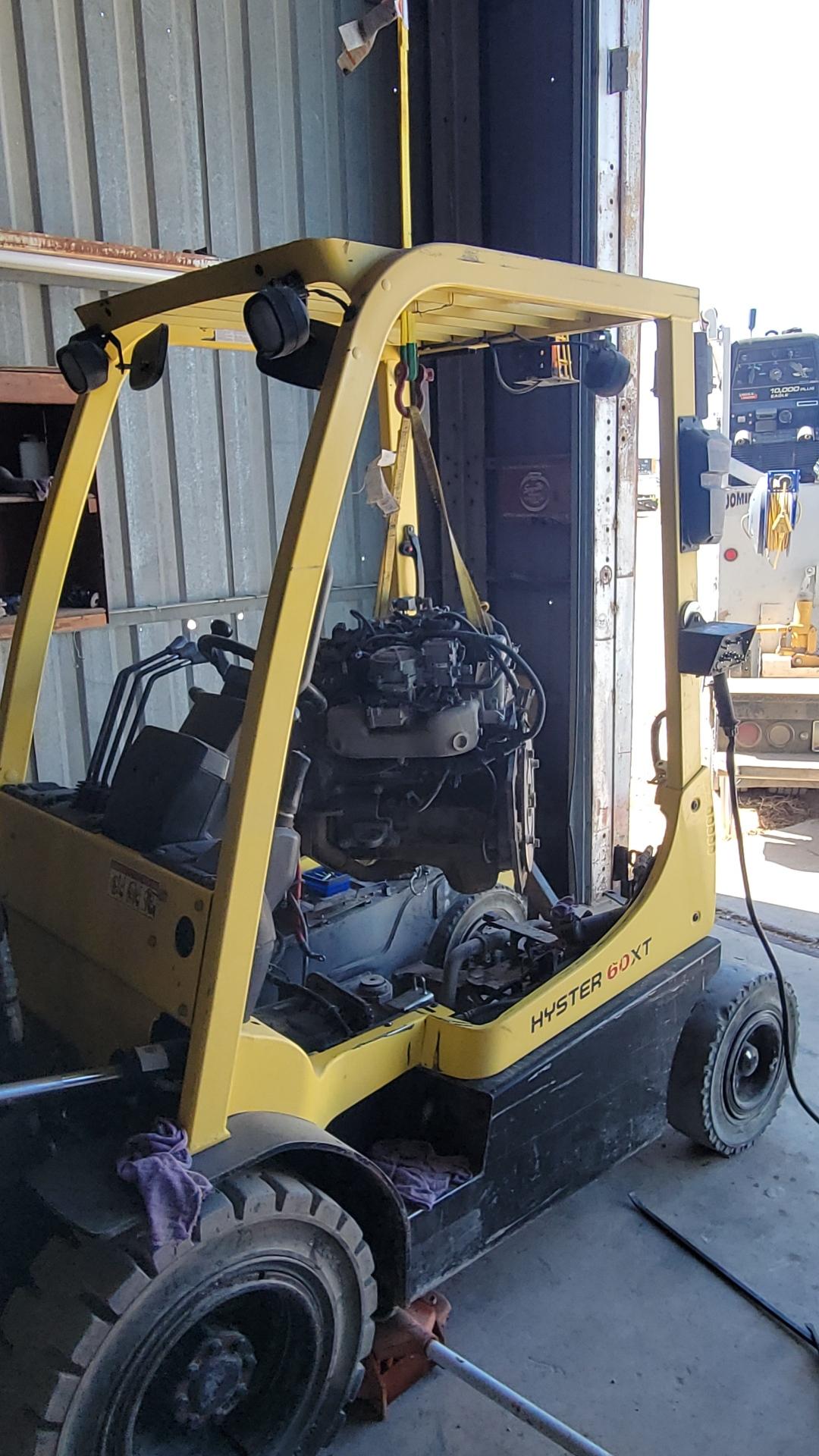 Hyster forklift engine being removed for rebuild at Thunder Mountain Solutions