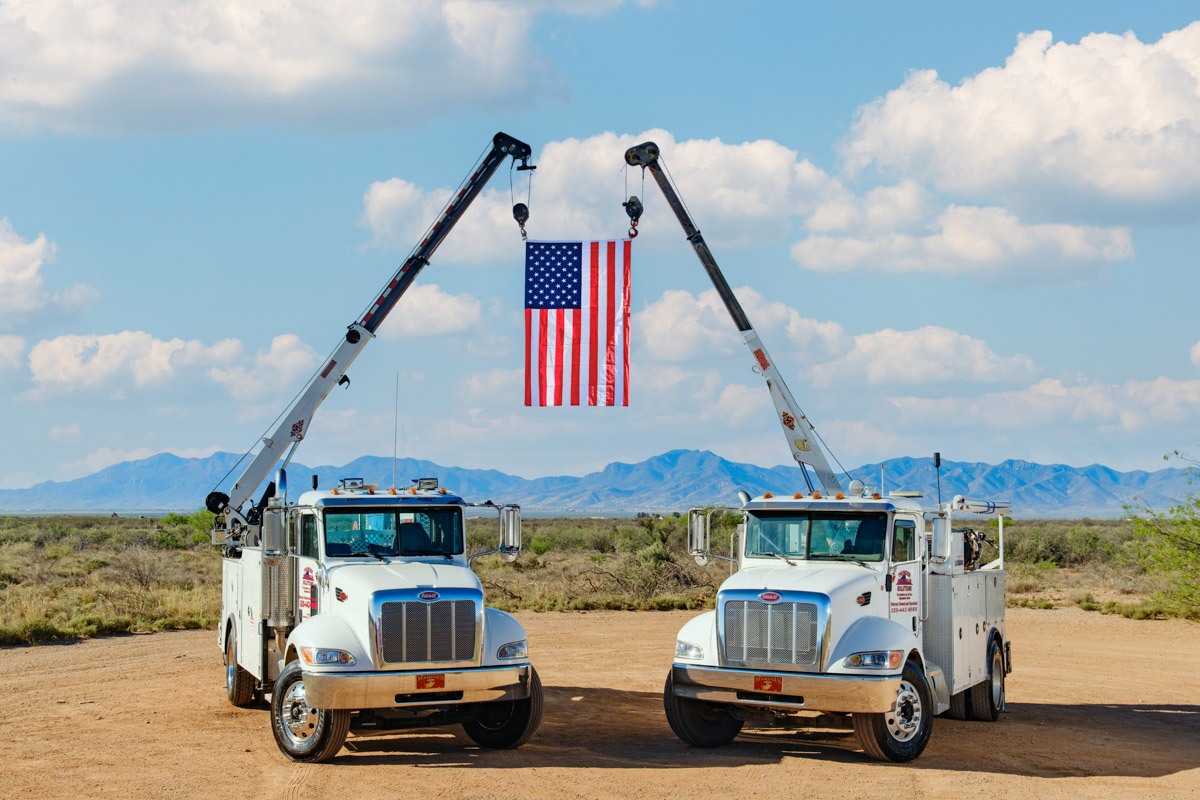 Thunder Mountain Solutions service truck with crane on a job site